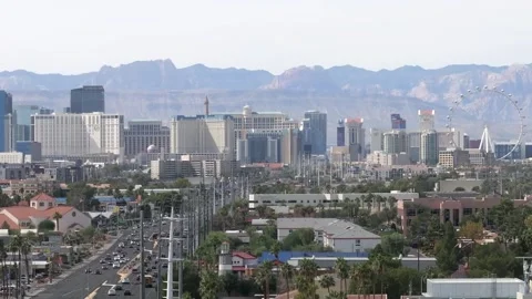 Aerial of the Las Vegas Strip during day time, rising drone shot of the Stock Footage 259432369