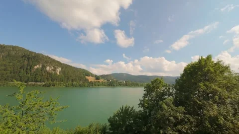 Aerial Lateral Flight Along Forested Ridge Above Alpine Lake Stock Footage 341830058