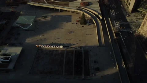 Aerial lateral flight looking down at Nathan Phillps Square and the Toronto sign Stock Footage 151922694