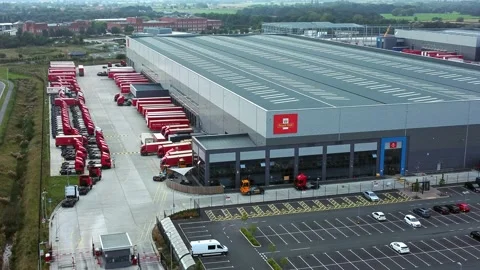 Aerial left orbit view parcel post distribution hub logistics lorry cargo Stock Footage 162259775