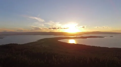 Aerial Left Pull Of Finely Point Sunset Over Flathead Lake Video stock 65512927