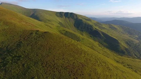 Aerial of lengthy mountain range with steep and gentle slopes in the Carpathians Stock Footage 93770752