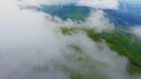 Aerial of a lengthy range under the cloud mantle in the Carpathians in summer Stock Footage 91955655