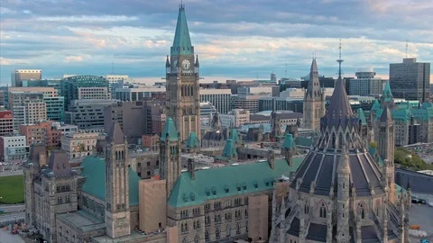 Aerial: Library of Parliament and Ottawa city skyline. Ontario, Canada. Stock Footage