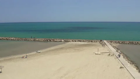 Aerial lifting up from white sandy beach to mediterranean turquoise sea Stock-Footage 150339725
