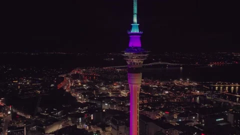 Aerial: Light show of sky tower, bridge and fireworks, Auckland city, New Stock Footage 167996625