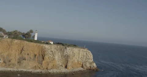 Aerial of lighthouse and beach cliffs, overcast day 스톡 동영상 105976779