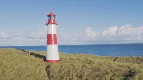 Aerial of lighthouse on a hill Stock Footage