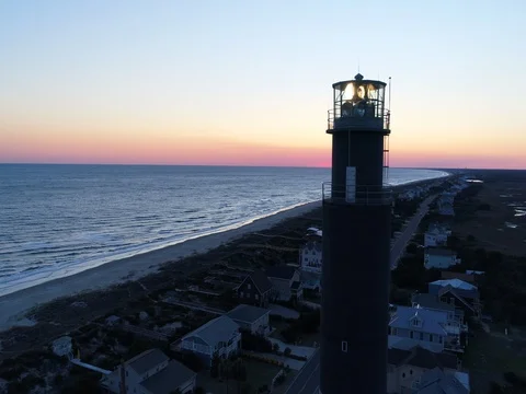 Aerial of lighthouse lights at sunset Stock Footage 73597583
