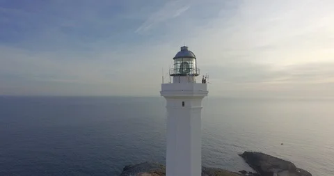 Aerial of lighthouse at seacoast Stock Footage 89963422