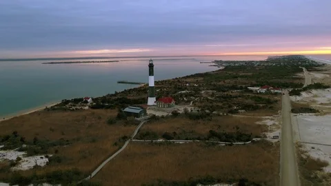 Aerial Lighthouse Sunrise Pull out Stock Footage