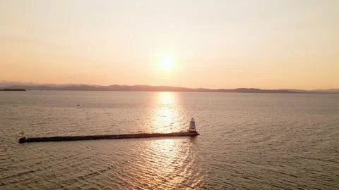 Aerial: Lighthouse at Sunset Stock Footage 141324515