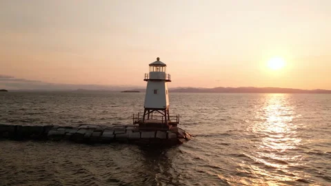 Aerial: Lighthouse at Sunset Stock Footage 141324689