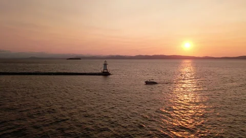 Aerial: Lighthouse at Sunset Stock Footage 141343491