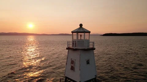 Aerial: Lighthouse at Sunset Stock Footage 141344125