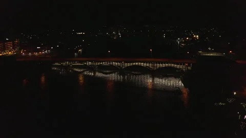 Aerial of Lit Bridge at Night with Reflection in The Water Stock Footage 152743940