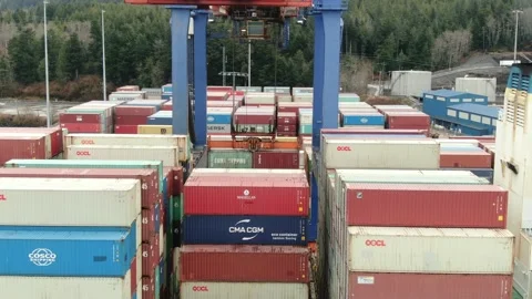 Aerial: Loading containers onto a Container Ship Stock Footage 149898974