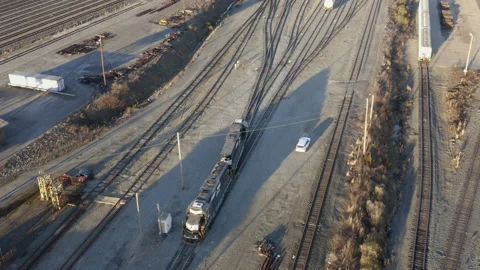 Aerial - Locomotive, train engine at intermodal rail terminal Stock Footage 147235448