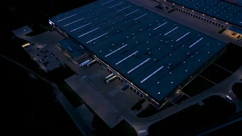 Aerial of a logistics park with a loading hub. Semi-trailers trucks stand at  Stock Footage 154352633