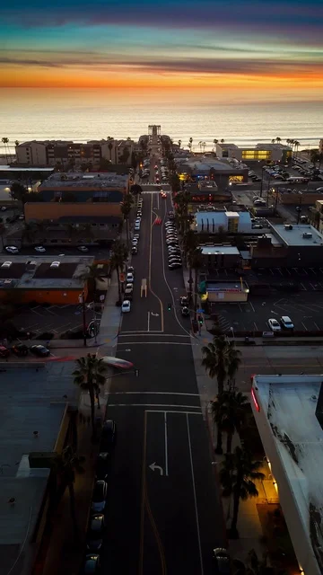 Aerial long exposure frames of street at sunset to create time lapse with sun. Stock Footage 85534524
