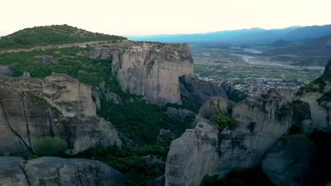 Aerial Long Flight Over Rock To Holy Monastery of Great Meteoron at Sunset... Stock Footage 334893615