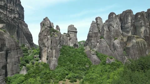 Aerial Long Flight Towards Famous Rock Formations Mountains and Trees. Blue.. Stock Footage 334893992