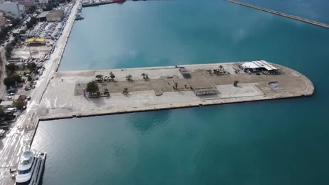 Aerial long pier dock with turquoise water and port infrastructure Stock Footage 337462755
