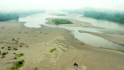 Aerial: Long Sand Flats Stretch Across Vast Swathes of the Amazon River in Fog i Stock Footage 149157463