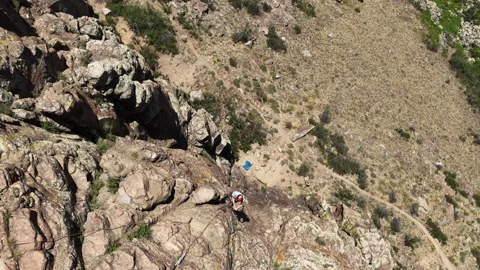 Aerial look down on rock climber in Golden Colorado in summer on Table Mountain Video stock 337130725
