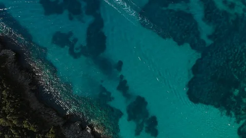 Aerial look down view of boat on sea beach coast line Video stock 107329525