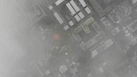 Aerial look down view city condominium building with PM 2.5 air pollution Stock Footage 126744001