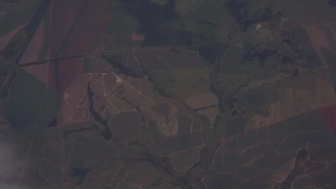 Aerial looking down at agriculural patterns and patchworks of fields on the Stock Footage 101302452