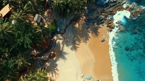 Aerial: Looking down at the beach with a bird's-eye view. Stock Footage 69869471