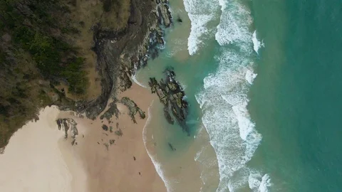 Aerial looking down at Byron Bay beach Stock Footage 121942881