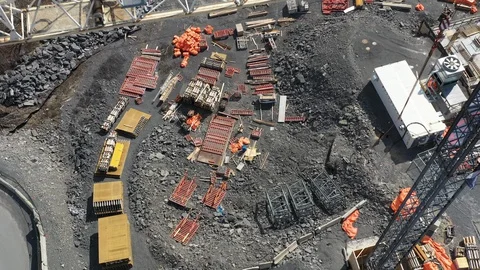 Aerial looking down in construction site over a crane Stock Footage 128605407