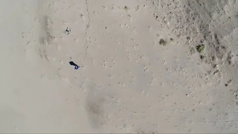Aerial Looking down on drone and man flying gesturing at it Stock Footage 72581022