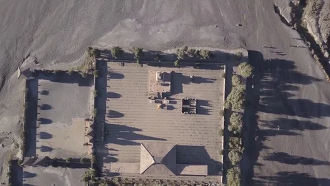 Aerial Looking down on Hindu temple in sea of sand in Bromo Java Indonesia Stock Footage 82247544