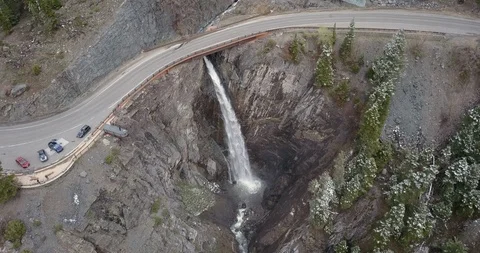 Aerial looking down on huge waterfall in the mountains from high above Stock Footage 111312006