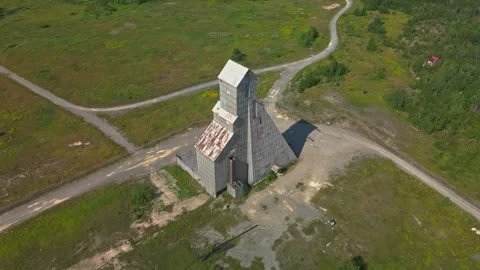 Aerial looking down on mining headframe Stock Footage 254908807