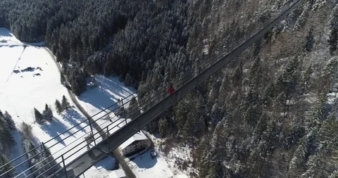 Aerial looking down on person walking along Highline 179, Austria Stock Footage 102492584