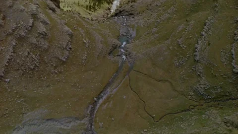 Aerial looking down to river in forest valley Stock Footage 276792555