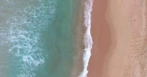 Aerial Looking down on waves breaking Video stock 69030649