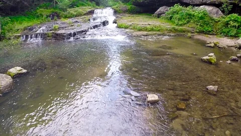 Aerial Looking over a Stream Stock Footage 115270334