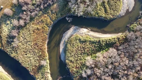 Aerial looking straight down and moving over a twisty stream  Stock Footage 219637689