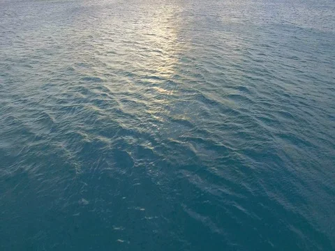 Aerial Looking up at Sunset over Vast Ocean in Cape Town, South Africa Stock Footage 79766438