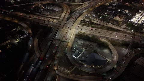 Aerial of Looping Los Angeles Freeway Ramps and Traffic at Night Stock Footage 345702350