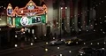 Aerial of Los Angeles El Capitan Theatre People Walk Hollywood Boulevard Night 4k or 4k+ Resolution