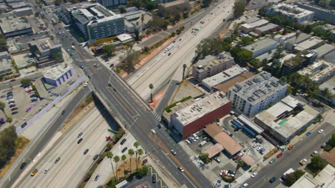 Aerial of a Los Angeles freeway with overpass and apartments Stock Footage 345706352