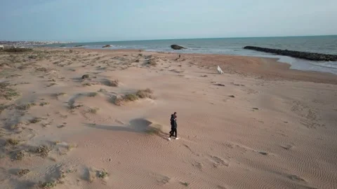 Aerial lovers view walking on beach sea shore sunset Sicily Donnalucata 스톡 동영상 184448761