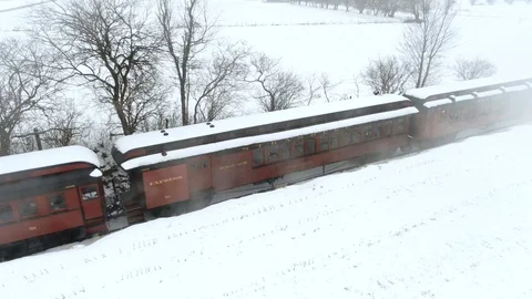 Aerial low angle engine smoke floats by as passengers seated in the Stock Footage 104695069